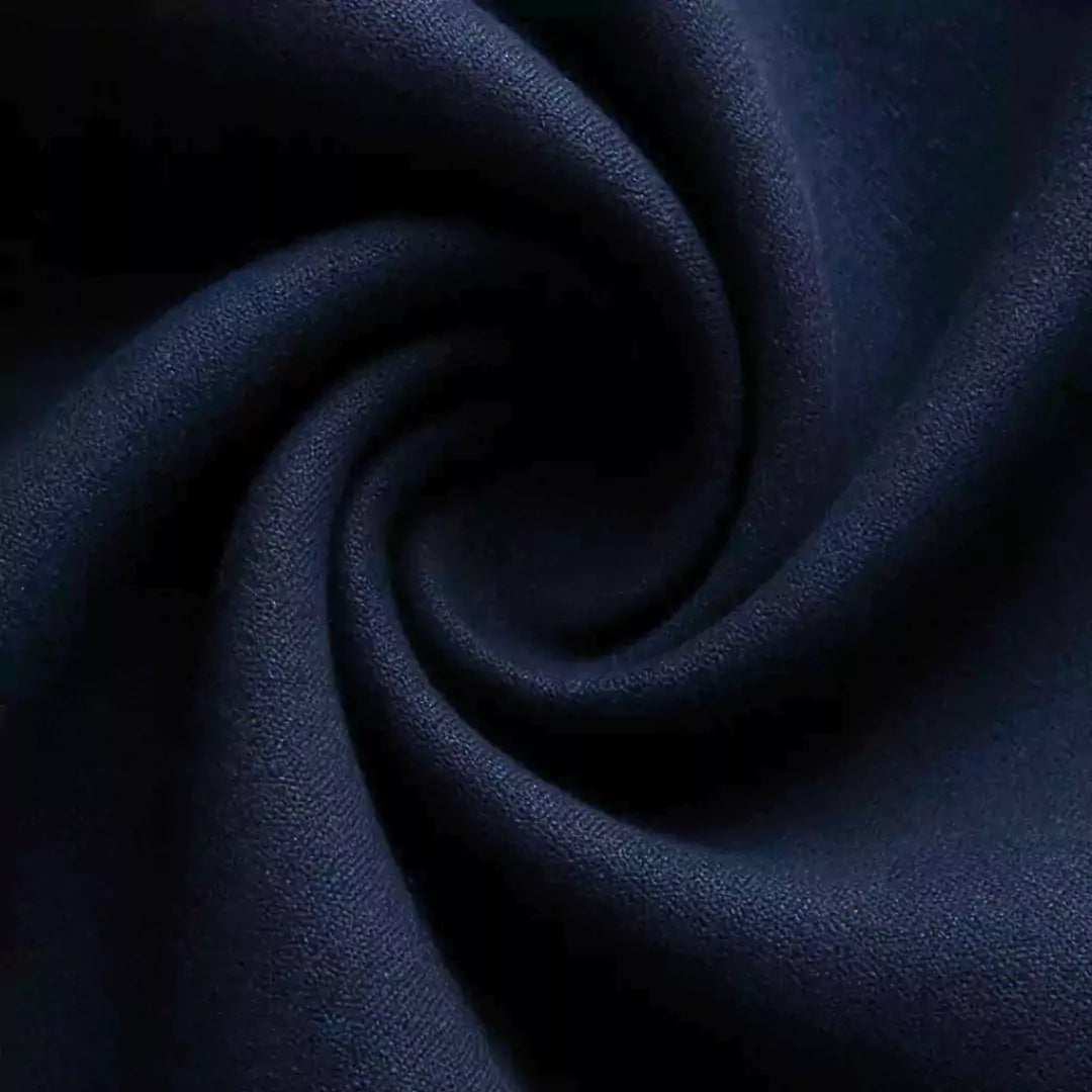 Close-up of dark blue fabric with a swirling pattern
